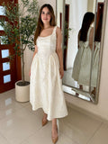 Vestido jacquard moño espalda